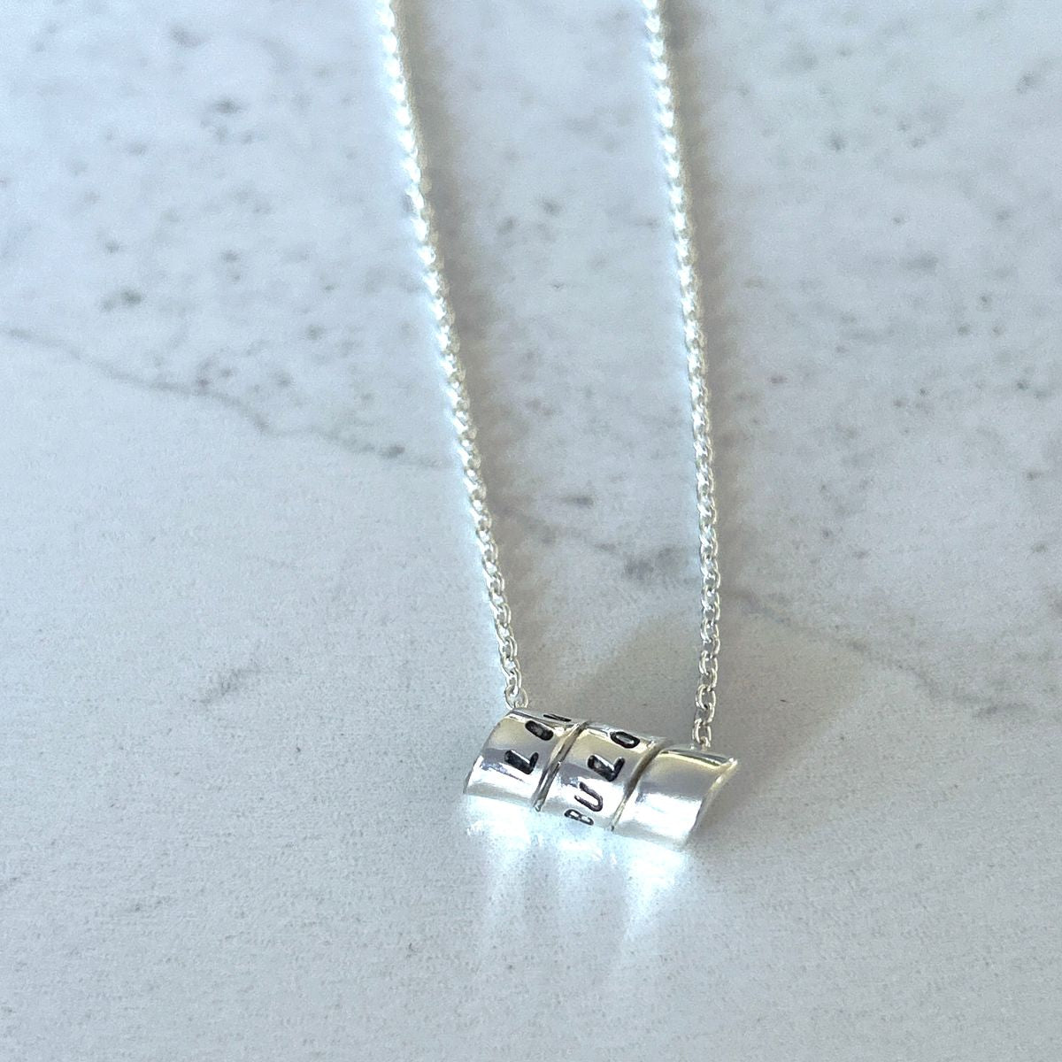 Secret Message Ribbon Pendant by Lynda Marion  for Positano Lifestyle Boutique