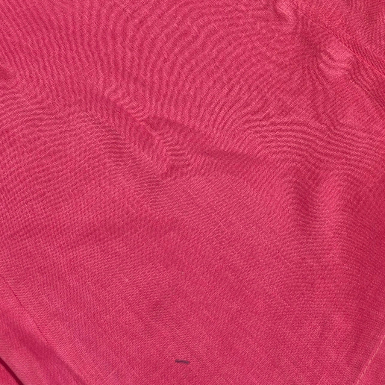 Close-up of a textured pink fabric surface