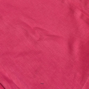 Close-up of a textured pink fabric surface